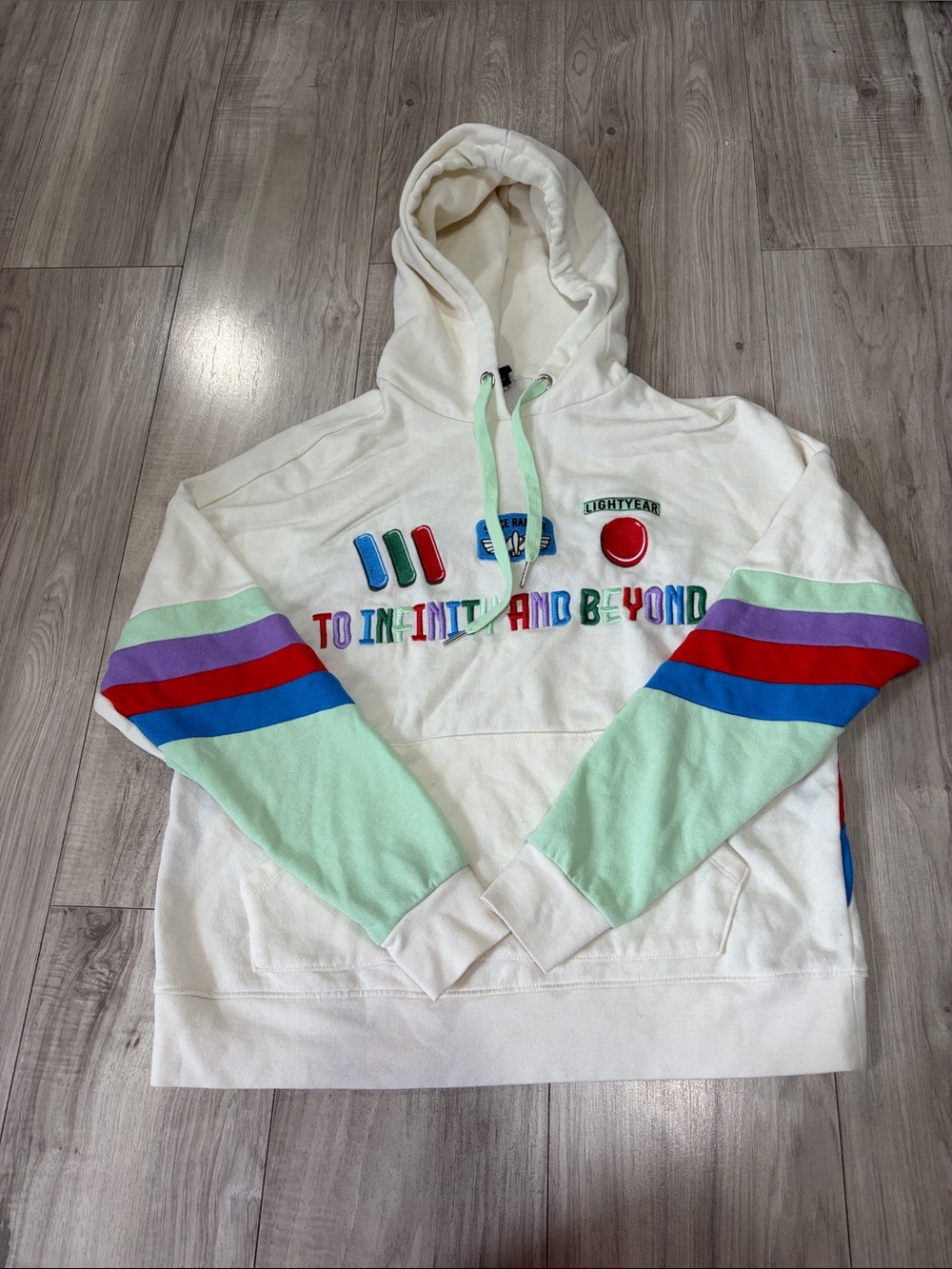 Cream Crewneck Hoodie with Mint Sleeves and Multicolor Embroidery